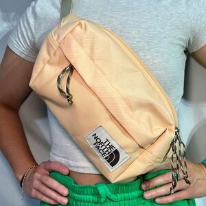 The North Face large peach, cross body bag